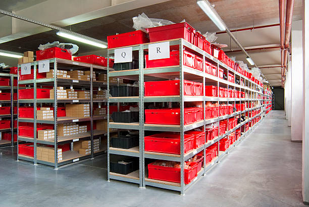 storage room with red plastic drawers and shelves